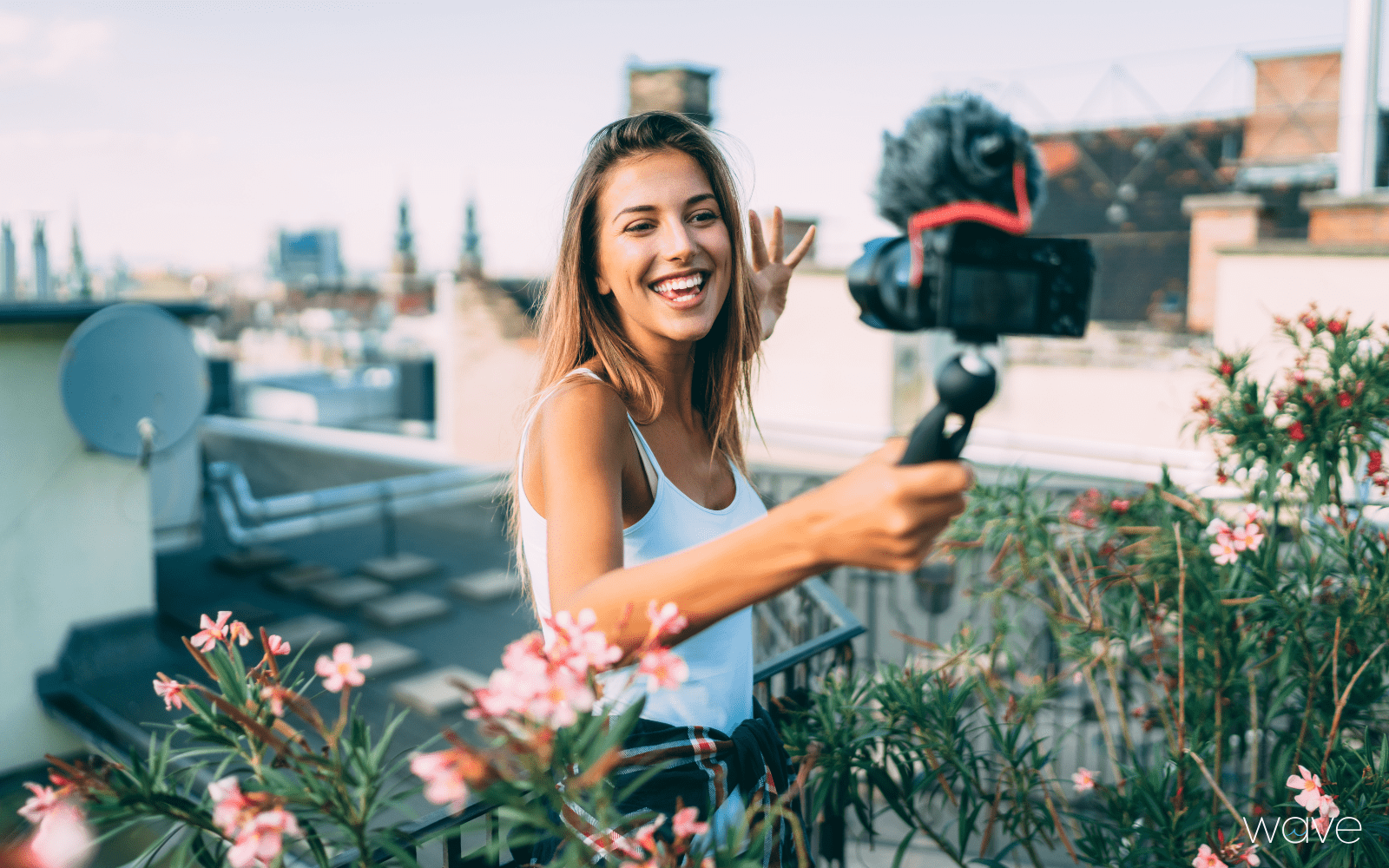 social media influencer filming on a rooftop